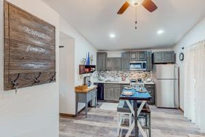 a kitchen with stainless steel appliances and a refrigerator at Two Canoe in Sonora