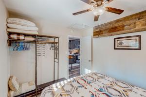 a bedroom with a bed and a ceiling fan at Two Canoe in Sonora