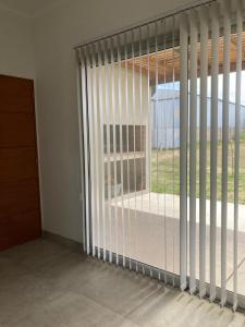a room with a window with blinds on it at La Casa de White in Colón Buenos Aires Province +48 photos