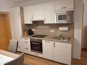 Kuchyň nebo kuchyňský kout v ubytování Ferienwohnung Oberkreut