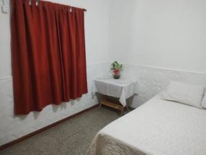 Ένα ή περισσότερα κρεβάτια σε δωμάτιο στο Casa Interna Paraná
