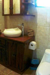 a bathroom with a sink and a toilet at Coco Banana Resort Appartment 1 in Las Galeras