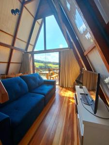 TV a/nebo společenská místnost v ubytování Chalés Roma