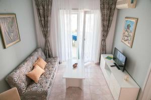 TV a/nebo společenská místnost v ubytování Apartment Kali 14116c