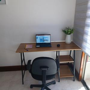 a desk with a laptop computer on top of it at Apartamento Vista azul rodadero Laureles 801 in Rodadero