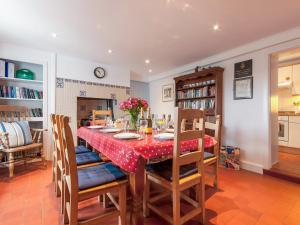 a dining room with a table and chairs at Ty Gwyn Farmhouse in St. Davids