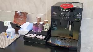 a coffee maker sitting on top of a counter at Aomori Green Park Hotel in Aomori