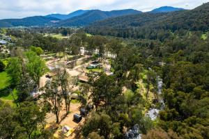 an aerial view of a park with mountains in the background at Bright Cabin Park in Bright