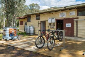 a bike parked in front of a building at Bright Cabin Park in Bright