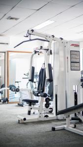 a gym with cardio equipment in a room at LAOTEL VIENTIANE in Vientiane
