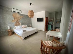 Voodi või voodid majutusasutuse 1 Corcega Beachfront Suites toas