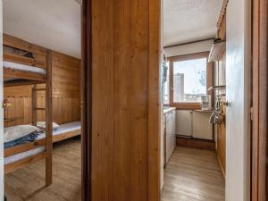 a room with two bunk beds and a window at Appartement Plagne 1800, 2 pièces, 7 personnes - FR-1-351-70 in Plagne 1800