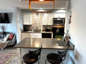 a kitchen with a table and chairs in a room at White Mountains Getaway with amazing views! in Bartlett