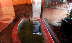 a bathroom with a bath tub with a shower at Nikko - House - Vacation STAY 96256v in Nikko