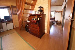 a room with a dresser and a staircase in a house at Nikko - House - Vacation STAY 96256v in Nikko