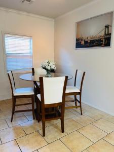 a dining room with a table and chairs at 3BR King Suite/Near Strip/Wi-Fi in Las Vegas