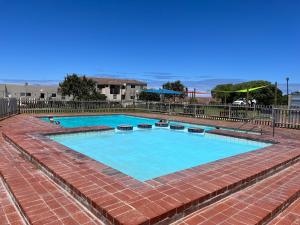 a large swimming pool on top of a building at #One6Eight in Hermanus