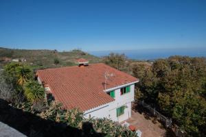 an aerial view of a house with a red roof at Finca pajaritos in Las Palmas de Gran Canaria