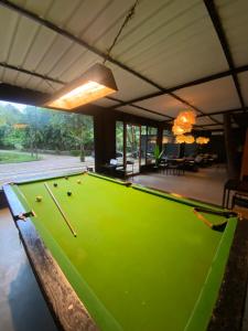 a pool table in the middle of a house at Bibhitaki Hostels Palolem Beach in Palolem