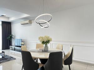 a dining room with a table and chairs at KSL Desplanade By Antlerzone in Johor Bahru