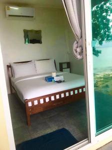 Postel nebo postele na pokoji v ubytování Sunrise Villas Seaview + 28 fotografií