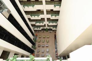 an overhead view of a courtyard between two buildings at Aavri Hotel in Dubai