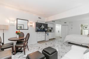 a bedroom with a bed and a table and chairs at Carriage Hills Retreat Rental in Edgar
