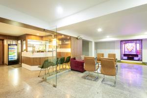 a conference room with a table and chairs at Hotel Krish - Near Medanta and Fortis Hospital Gurugram in Gurgaon