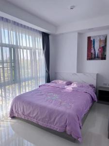 Cama ou camas em um quarto em 两室一厅两卫清迈市中心舒适大平层