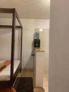 a bedroom with a bunk bed and a radio on a counter at COSY STUDIO APARTMENT CENTRALLY-LOCATED LOCATED IN SOUTH B WITH LIFTS AND FREE PARKING in Nairobi