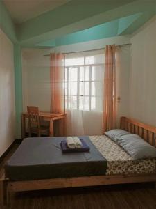 Postel nebo postele na pokoji v ubytování Pas-it Hostel Sagada