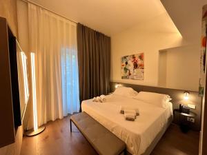 Postel nebo postele na pokoji v ubytování Palazzo Sangiorgio