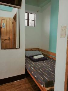 Postel nebo postele na pokoji v ubytování Pas-it Hostel Sagada