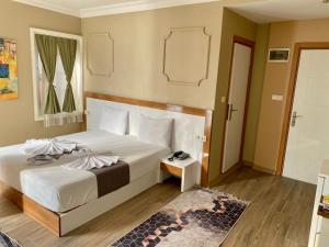 Postel nebo postele na pokoji v ubytování Airport Best Hotel