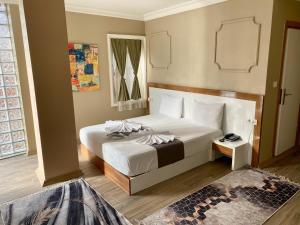 Postel nebo postele na pokoji v ubytování Airport Best Hotel + 24 fotografií