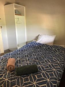 a bedroom with a bed with a green towel on it at Yealering Hotel in Yealering