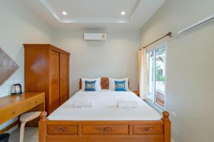Letto o letti in una camera di Lightplus Khao Lak