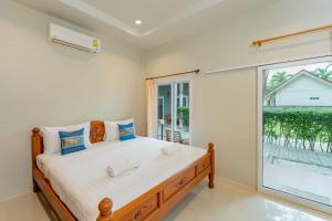 Letto o letti in una camera di Lightplus Khao Lak