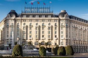 a large building with a sign on top of it at The Westin Palace, Madrid in Madrid