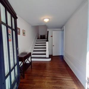 a hallway with a staircase and a stair case at Sunny SF home - cozy, spacious, convenient w/parking, A+ location!! in San Francisco