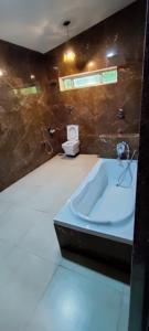 A bathroom at Jimira Resort , Shivrajpur