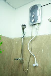 a shower in the corner of a bathroom at Samee Dream Guest in Midigama East