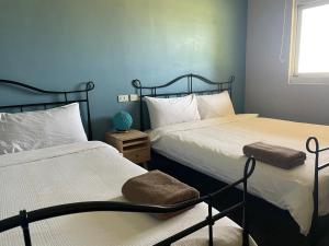 Postel nebo postele na pokoji v ubytování Lanyu IGANG Hotel + 7 fotografií