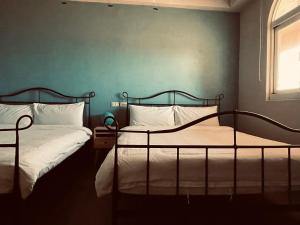 Postel nebo postele na pokoji v ubytování Lanyu IGANG Hotel