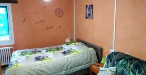 a bedroom with a bed with writing on the wall at GITE les p'tites cagouilles in Saint-Germain-du-Seudre +43 photos