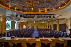 an empty auditorium with a large table and chairs at Odyssee Resort Thalasso & SPA in Zarzis +74 photos