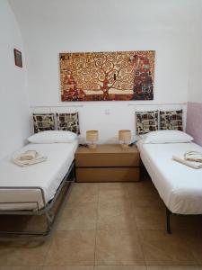 Ένα ή περισσότερα κρεβάτια σε δωμάτιο στο NONNA ADRIANA