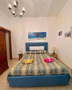a bedroom with a bed with two pillows on it at Casa Vacanze Torre di Mola in Formia