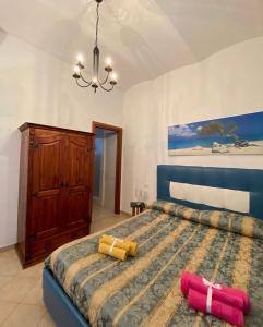 a bedroom with a large bed with two pillows on it at Casa Vacanze Torre di Mola in Formia