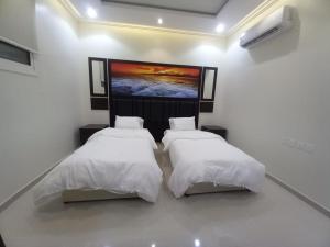 Een bed of bedden in een kamer bij شقق مفروشة